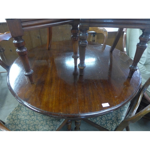 230 - A George IV mahogany circular tilt-top breakfast table and six Victorian mahogany balloon back dinin... 