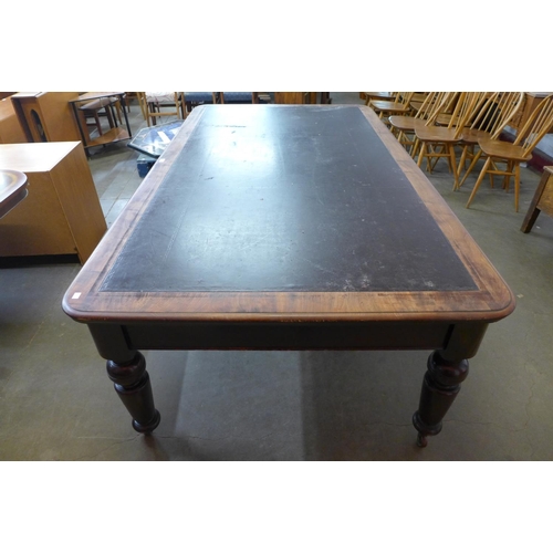 26 - A Victorian mahogany and brown leather topped double sided eight drawer library table, 76cms h, 214c... 