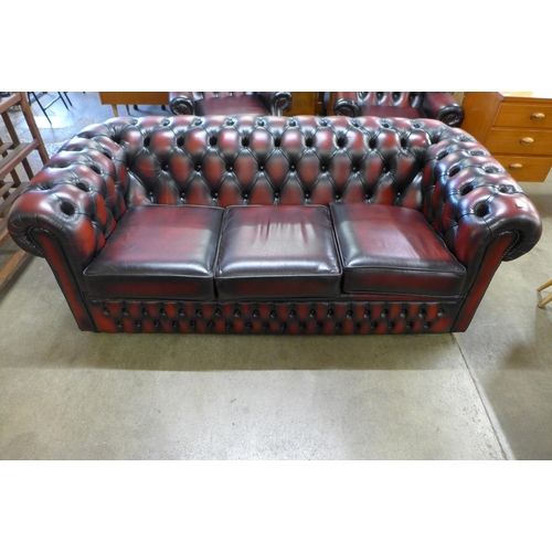 3 - An oxblood red leather Chesterfield settee