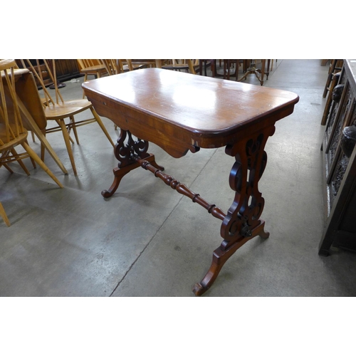 4 - A Victorian mahogany single drawer stretcher table