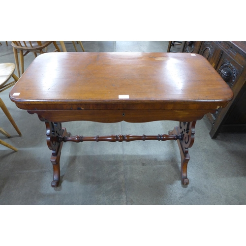 4 - A Victorian mahogany single drawer stretcher table