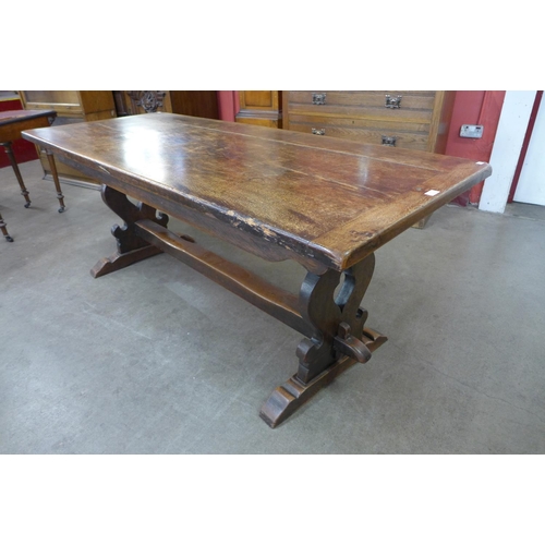 48 - An 18th Century style oak refectory table, 74cms h, 183cms l, 76cms w