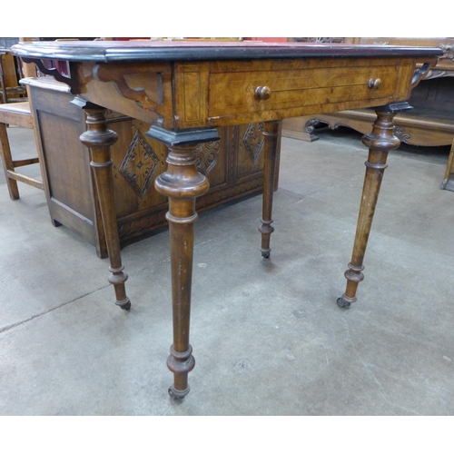 6 - A Victorian inlaid walnut and red leather topped single drawer lady's writing table