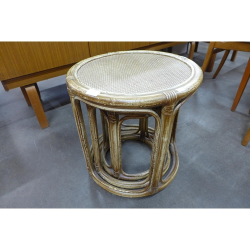 72 - A circular bamboo and rattan nest of tables