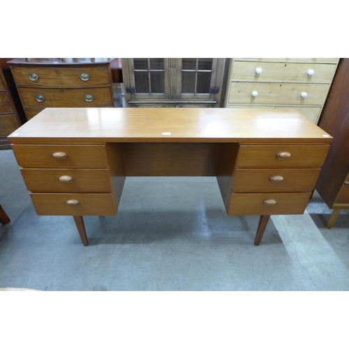 96 - An Austin Suite teak desk