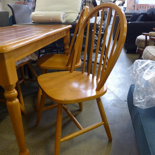 1590 - A beech kitchen dining table with tiled top and four dining chairs