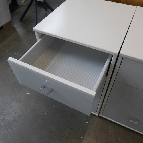 1511 - A pair of white painted high gloss two drawer bedsides * this lot is subject to VAT