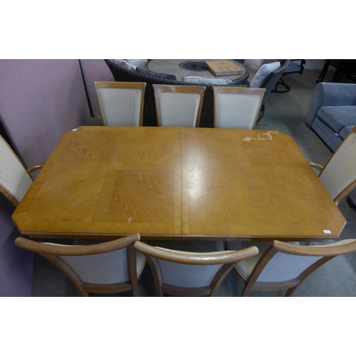 1526 - An American ash dining table and eight chairs - marked