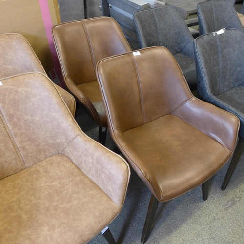 1545 - A pair of brown vegan leather side chairs