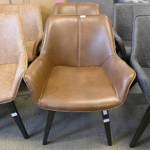 1545 - A pair of brown vegan leather side chairs