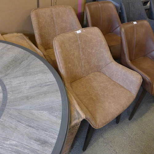 1546 - A pair of tan vegan leather side chairs