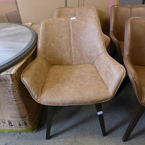 1546 - A pair of tan vegan leather side chairs