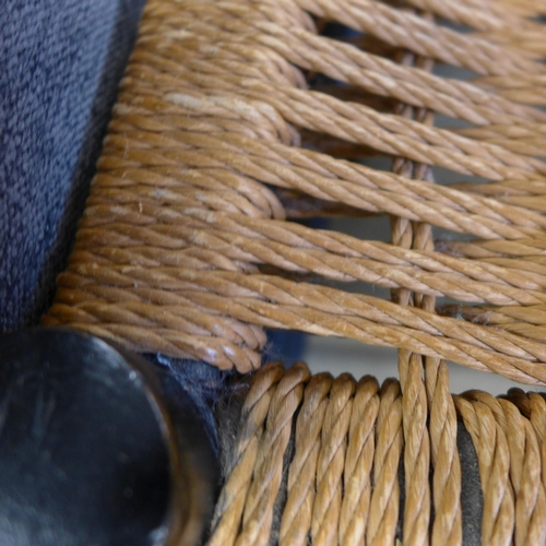 1558 - A pair of black painted and wicker dining chairs