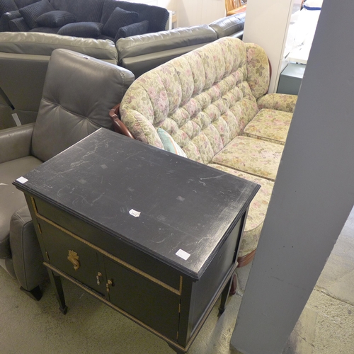 1578 - A dark stained wood and floral upholstered cottage sofa and a black painted cabinet