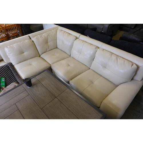 1600 - A cream leather lefthand facing corner sofa