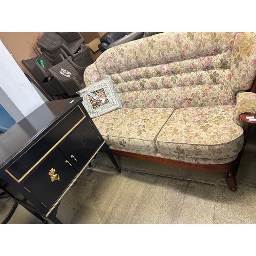 1578 - A dark stained wood and floral upholstered cottage sofa and a black painted cabinet