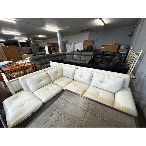 1600 - A cream leather lefthand facing corner sofa