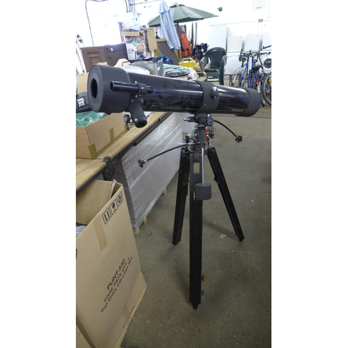 2431 - A Tasco telescope and a tripod stand