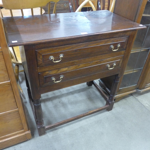 150 - A George III style Ipswich oak two drawer side table