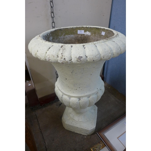 240A - A painted concrete campana shaped garden urn