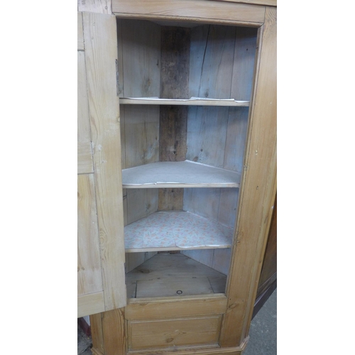 201 - A George III pine freestanding corner cupboard