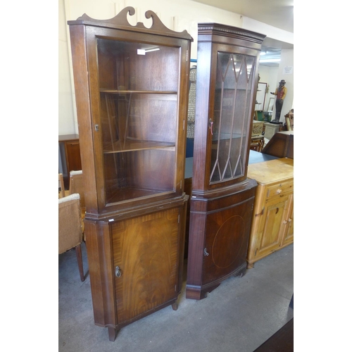 214 - Two mahogany freestanding corner cabinets