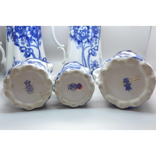 602 - A set of five graduated Doulton Burslem blue and white jugs