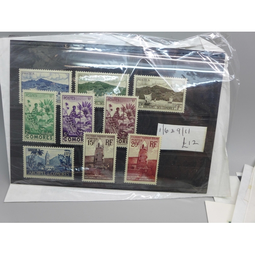 613 - Stamps; a collection of stamps in packets and stock cards