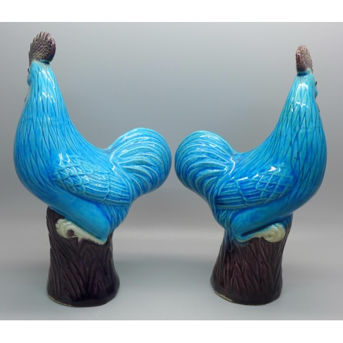 621 - A pair of blue glazed cockerel figures, 19.5cm