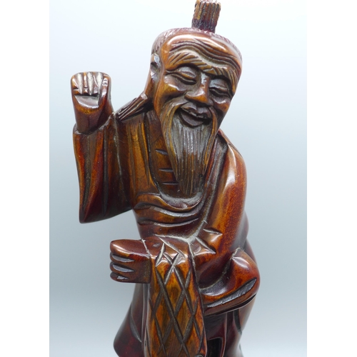 624 - Treen including a hand carved figure of a Chinese fisherman, 24cms, and three hardwood turned lidded... 