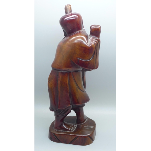 624 - Treen including a hand carved figure of a Chinese fisherman, 24cms, and three hardwood turned lidded... 