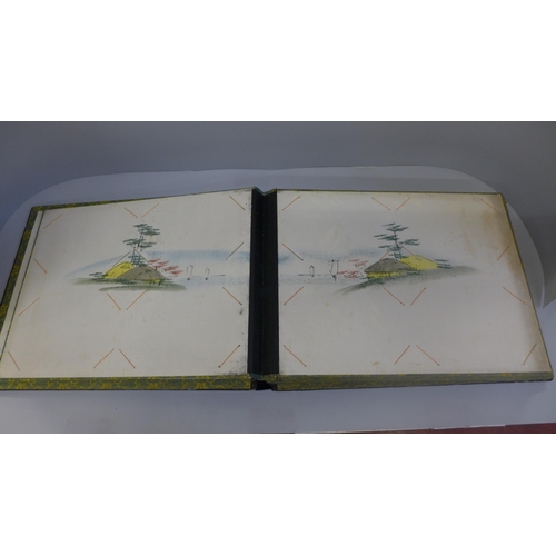 642 - An oriental photograph album with lacquered cover