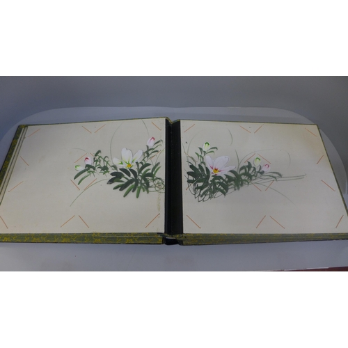 642 - An oriental photograph album with lacquered cover