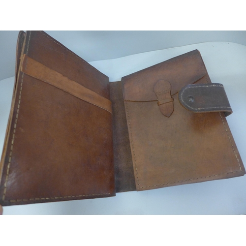 665 - A leather travelling writing folio