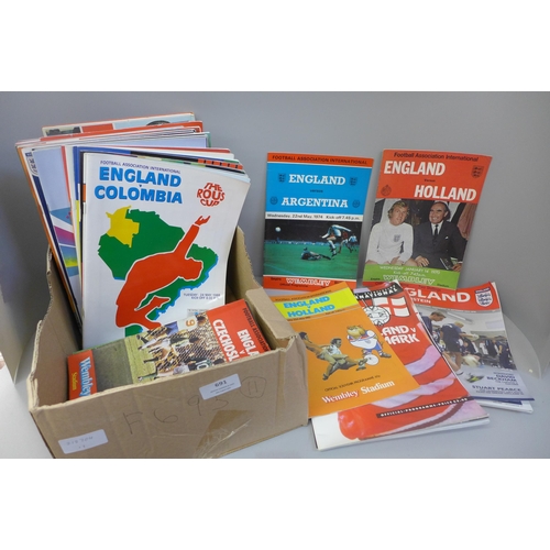 691 - Sporting memorabilia; a collection of England home football programmes and three books