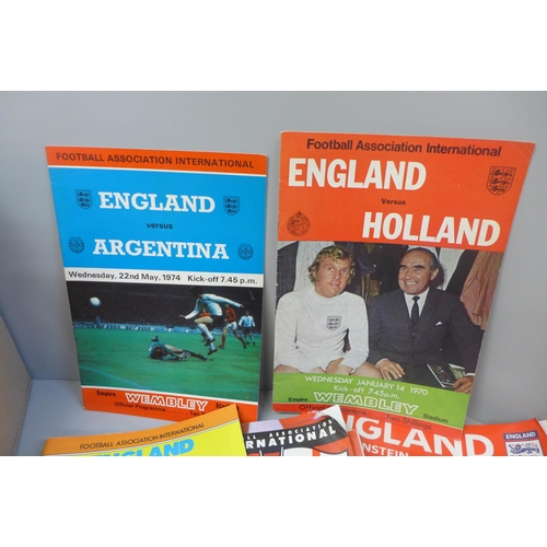 691 - Sporting memorabilia; a collection of England home football programmes and three books