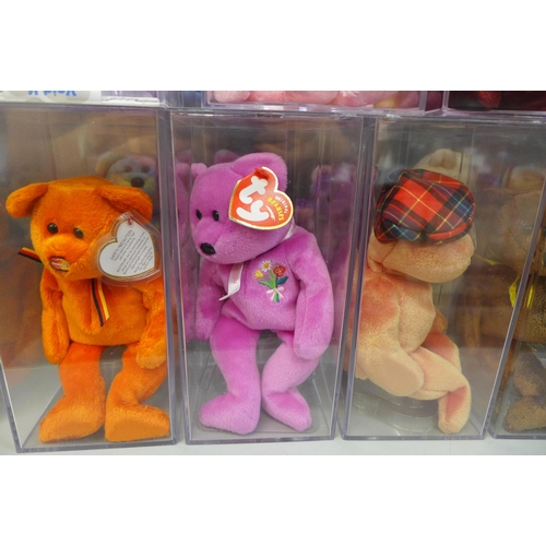 710 - A collection of Ty Beanie Babies in plastic cases