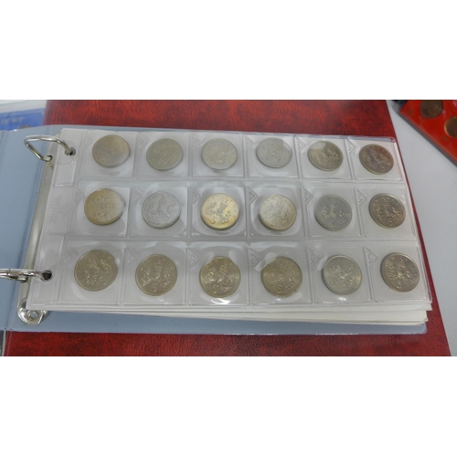 725 - A collection of GB coin sets and an album of coins