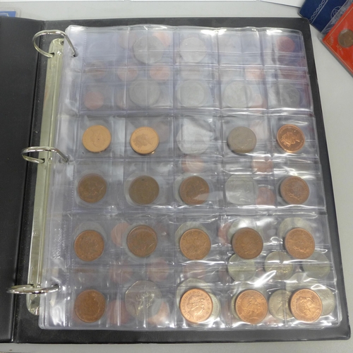 725 - A collection of GB coin sets and an album of coins