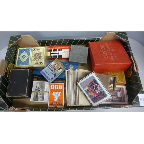 734 - A collection of cards, postcards, Senior Service cigarette cards, chessmen, etc.