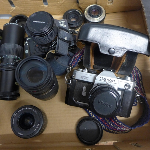 748 - A collection of cameras and camera equipment, lenses, etc.