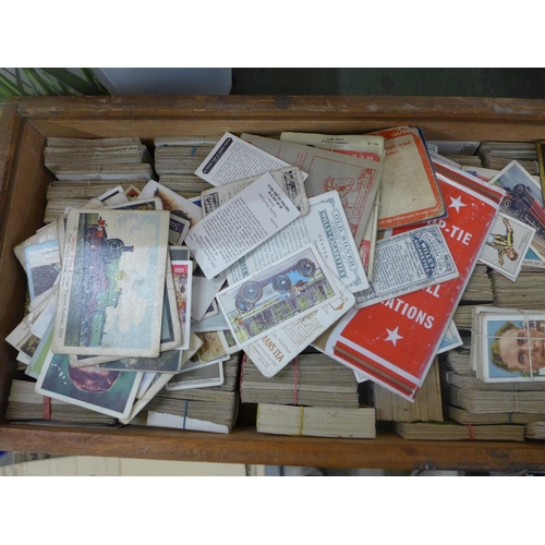 749 - A large collection of cigarette cards including Players, Wills, etc.