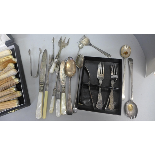 753 - A collection of plated cutlery