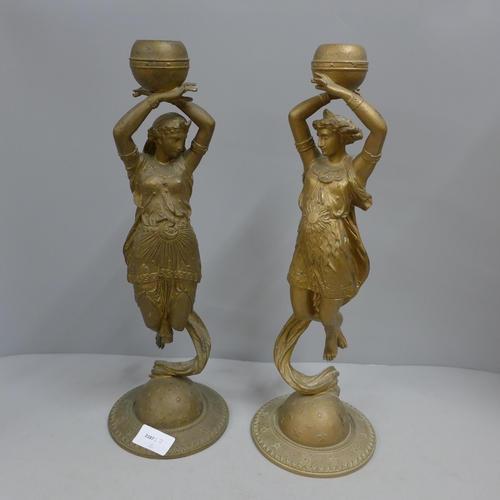 760 - Two Spelter figural candlesticks, 37cm