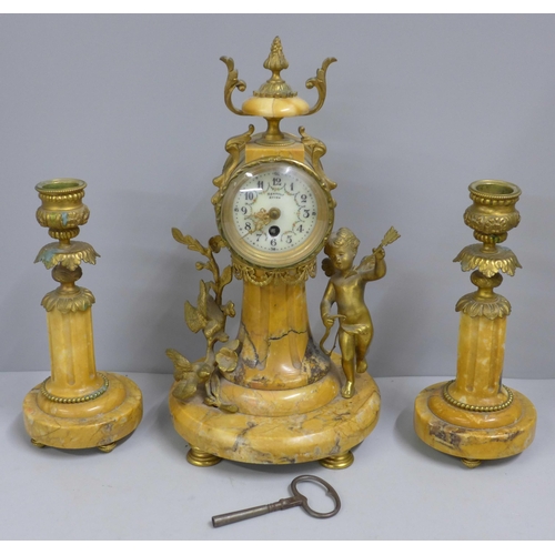 764 - A 19th Century French yellow marble and gilt metal clock garniture, with cupid, the porcelain dial m... 