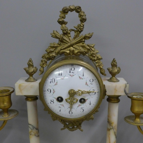 765 - A French white marble and gilt metal clock garniture with porcelain dial, 38cm