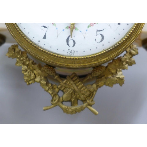 765 - A French white marble and gilt metal clock garniture with porcelain dial, 38cm