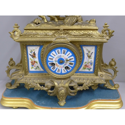 766 - A French 2nd Empire style mantel clock with a gilt spelter ornamented case, circa 1860, the case wit... 