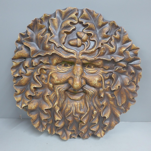 770 - A Green Man hand made wall hanging, 34cm diameter