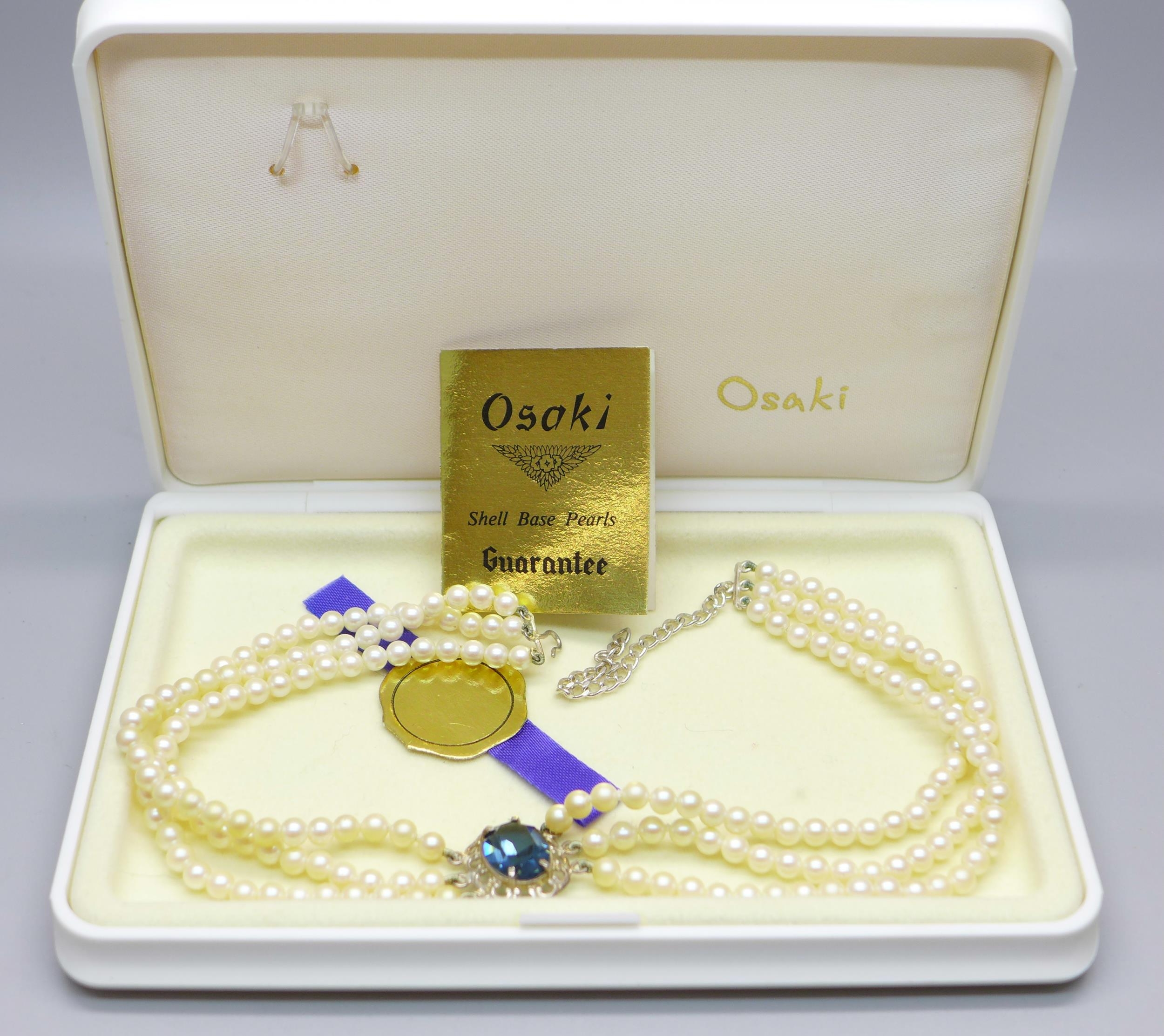 A triple string of Osaki pearls